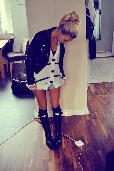 rain boots and oversized sweater