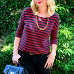 black handbag with gold clasp